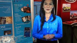 Hologram of Latina airport worker with blue shirt and hands clasped, ready to help